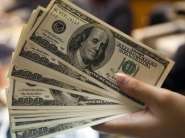 Juros nos EUA e cen�rio interno contribuem e d�lar fica abaixo de R$ 3,90