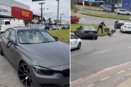 Briga no trnsito termina com BMW, moto e placa de sinalizao destrudas em Blumenau